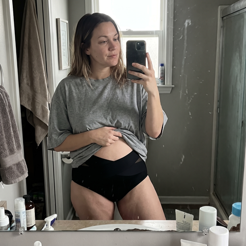 The Nestled Wrap worn under everyday clothing, lifestyle photo