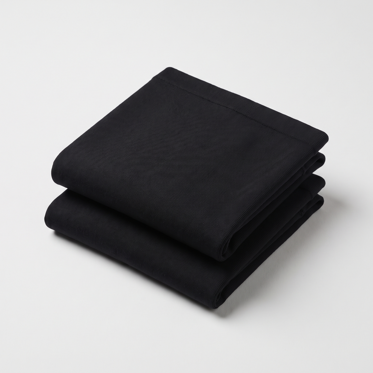 The Nestled Wrap 2-pack, folded flat-lay showing both wraps included