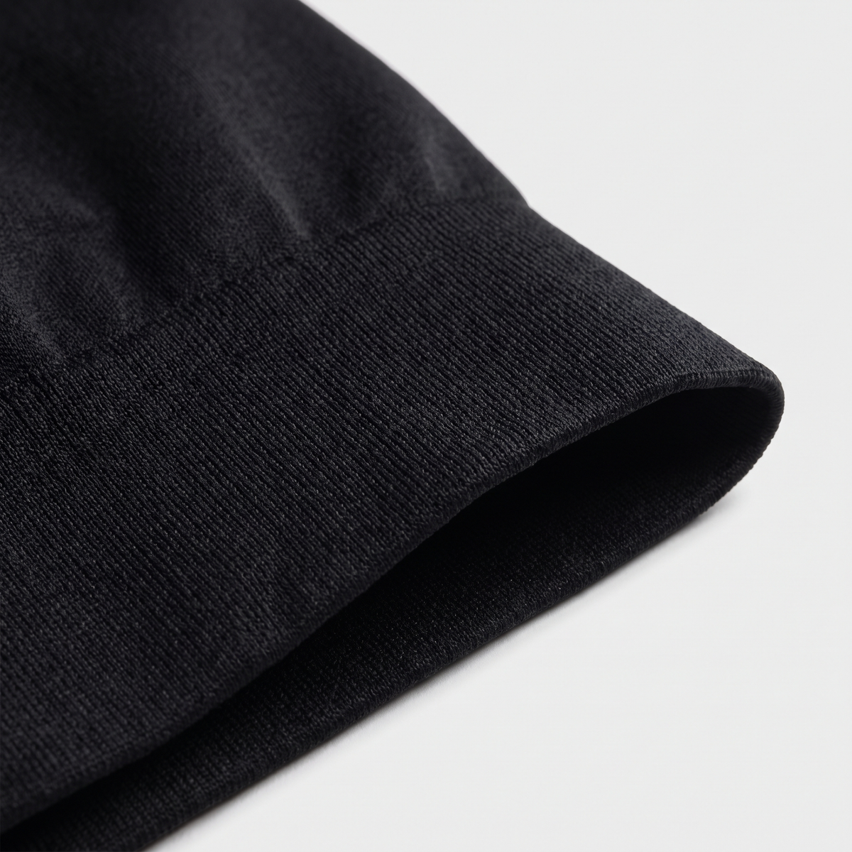 Close-up of the Nestled Wrap's seamless knit fabric and wide waistband
